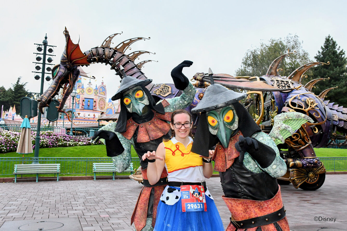 Girl posing with characters during half marathon run