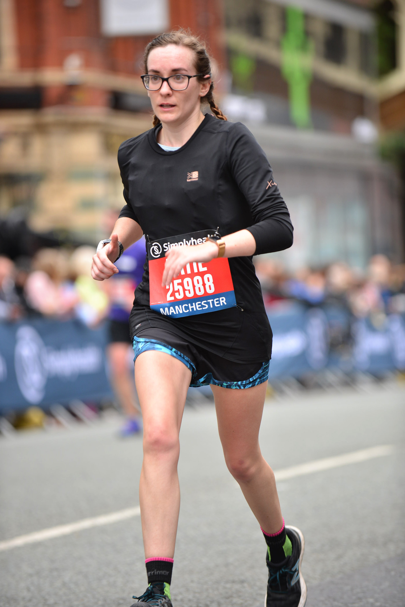 Girl (Katie) running towards finish line in Great Manchester Run Half Marathon Event