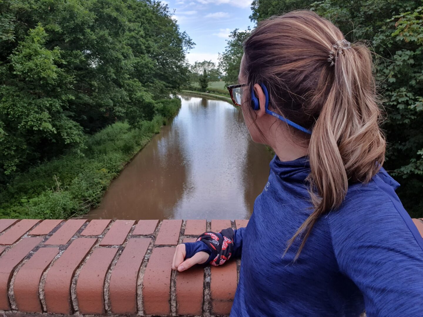 Marathon Training - Girl on canal bridge looking over water