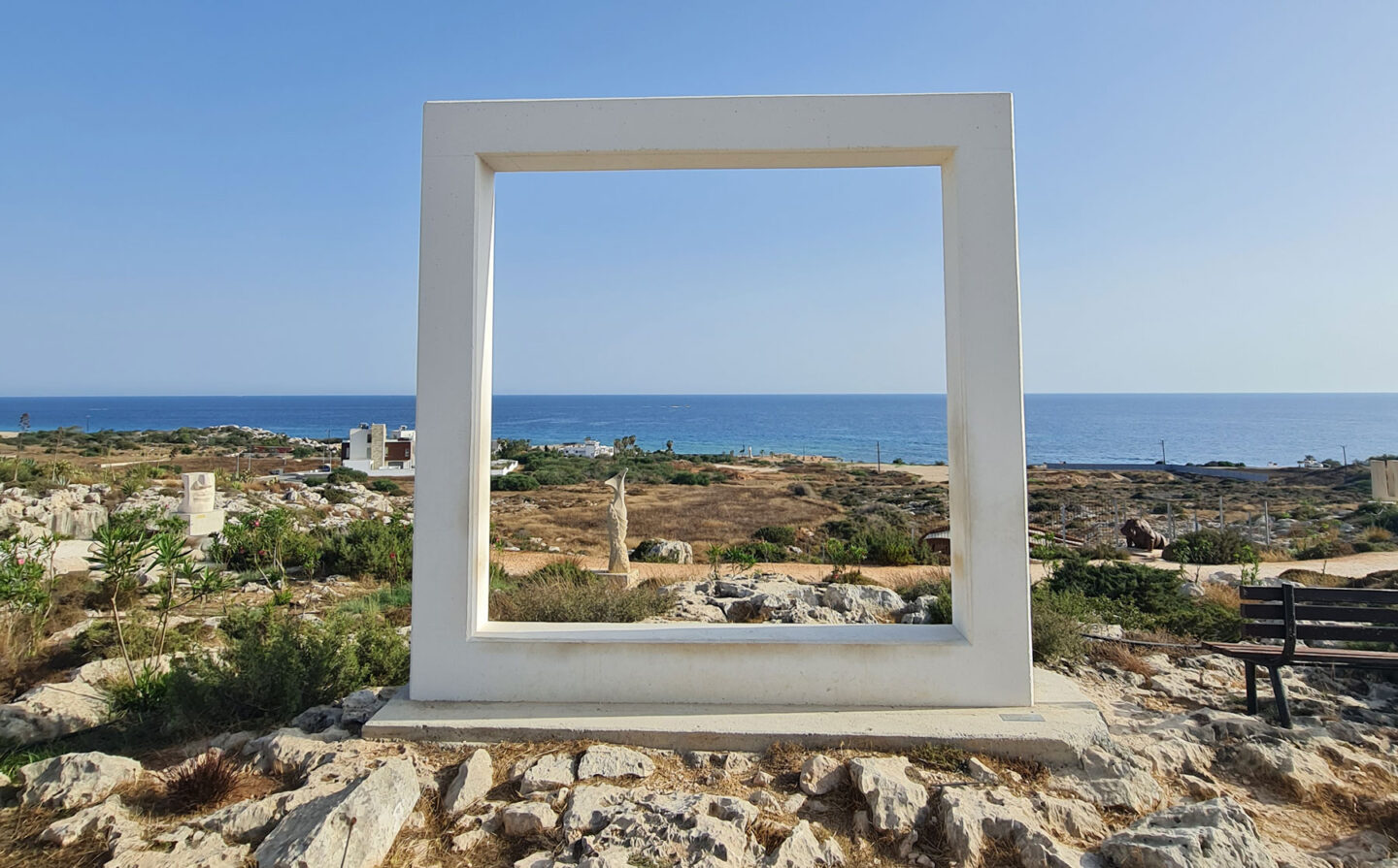 Empty frame sculpture with sea in background at ayia napa sculpture park