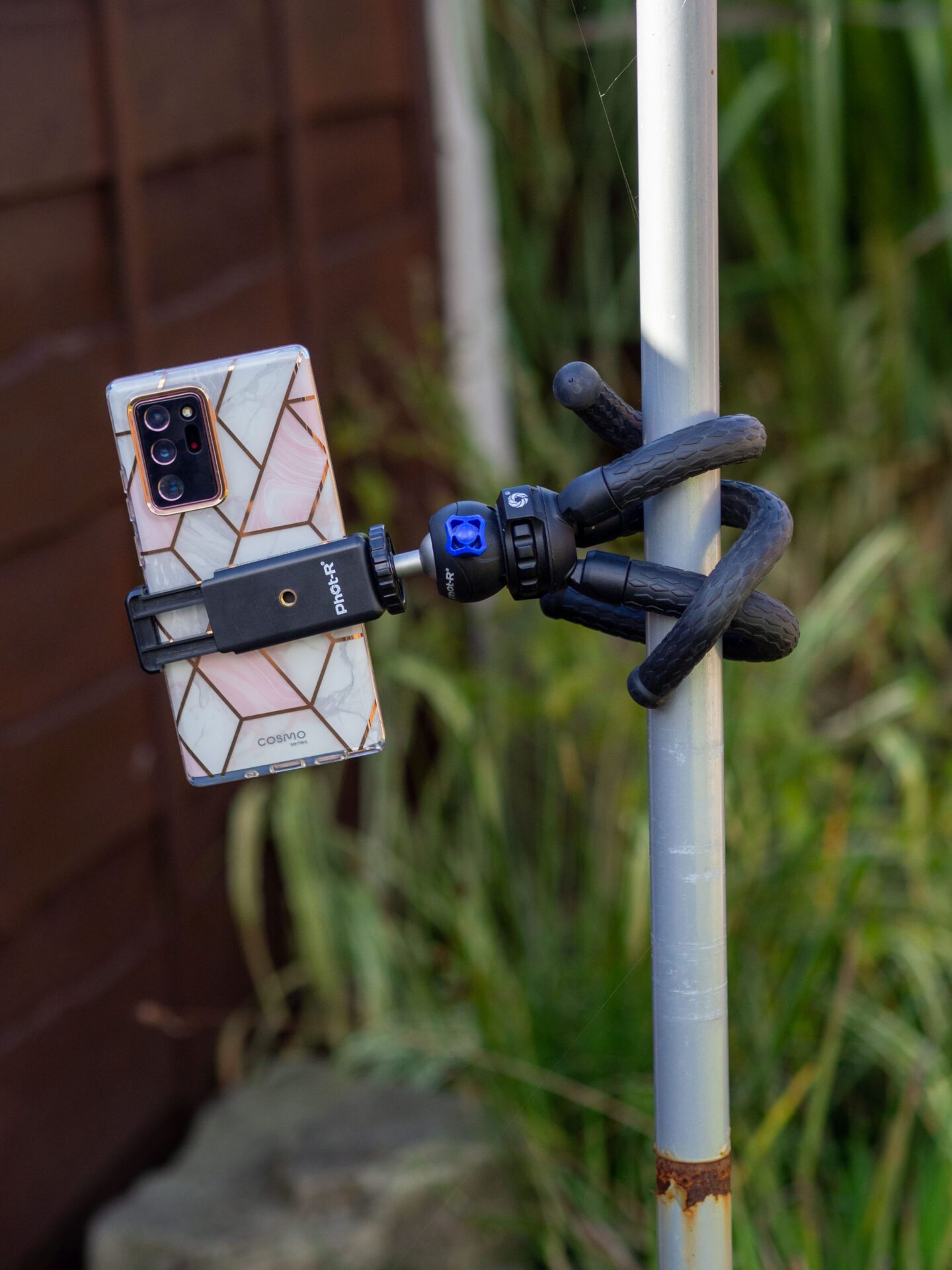 Flexible tripod wrapped around pole